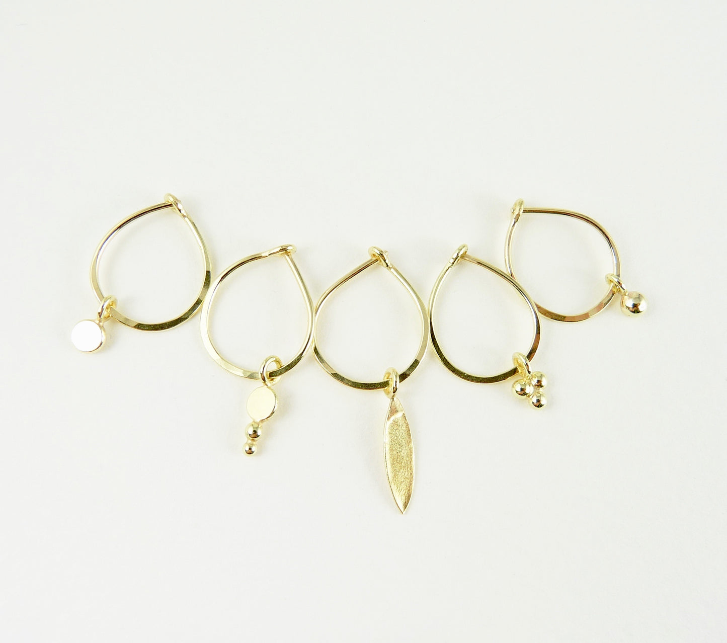18ct Gold hoop earring with assorted gold charms