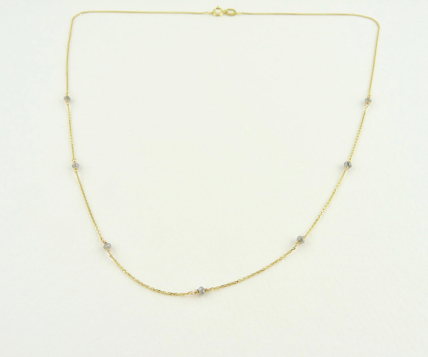 Delicate Gold chain sprinkled with grey diamonds