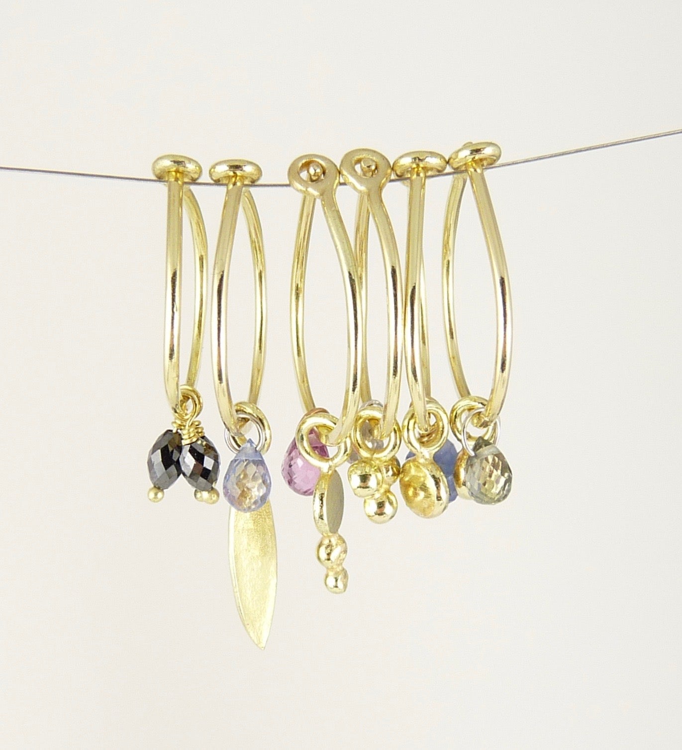 18ct Gold hoop earring with leaf and blue sapphire briolette
