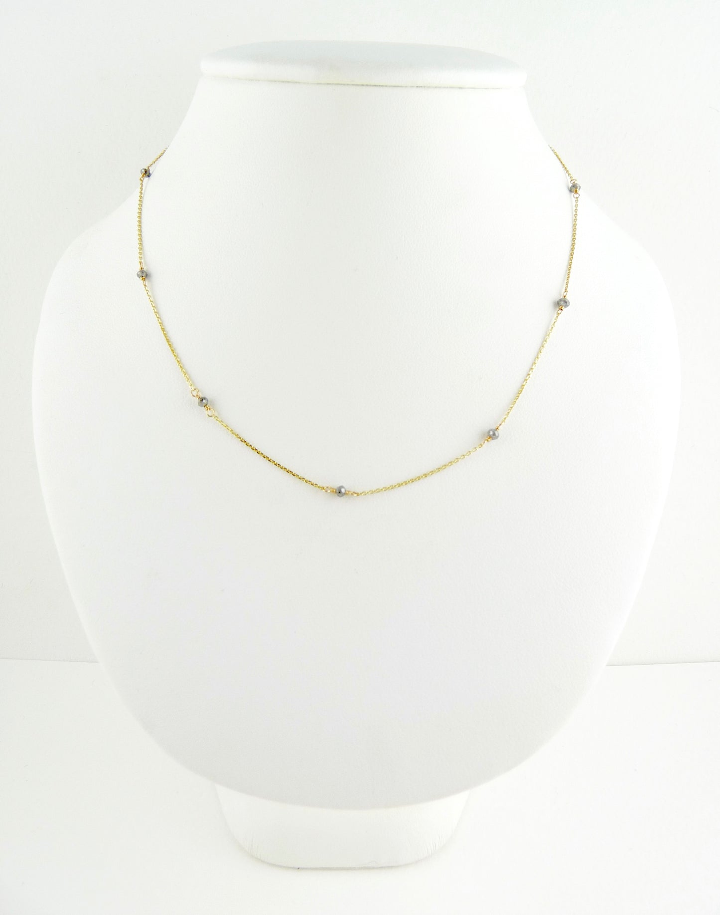 Delicate Gold chain sprinkled with grey diamonds