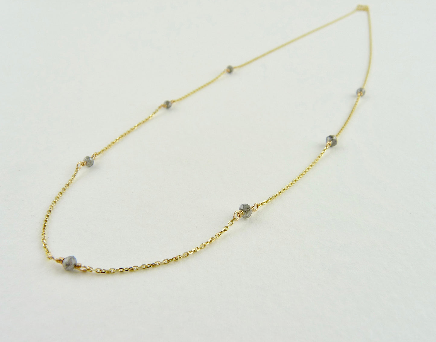 Delicate Gold chain sprinkled with grey diamonds
